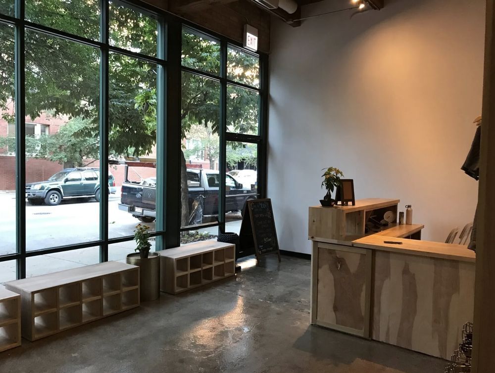 A large room with a lot of windows and a wooden counter.