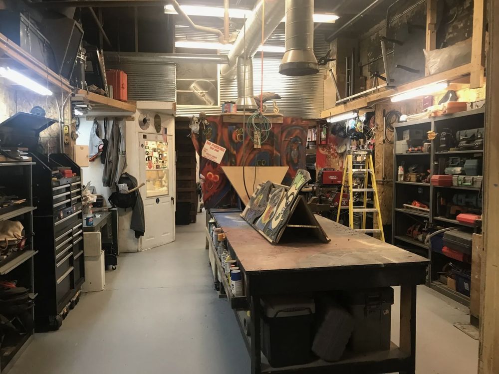 There is a large wooden table in the middle of the room.