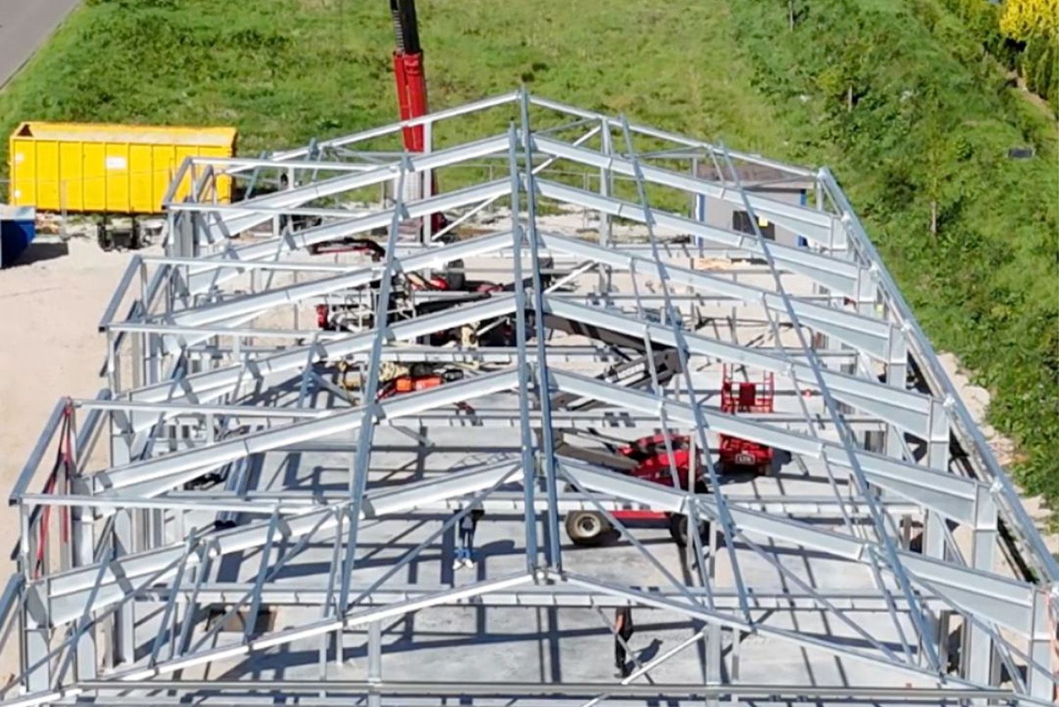 An aerial view of a large metal structure under construction.