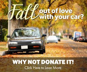 A car parked on a tree-lined street with fall leaves. Text: 