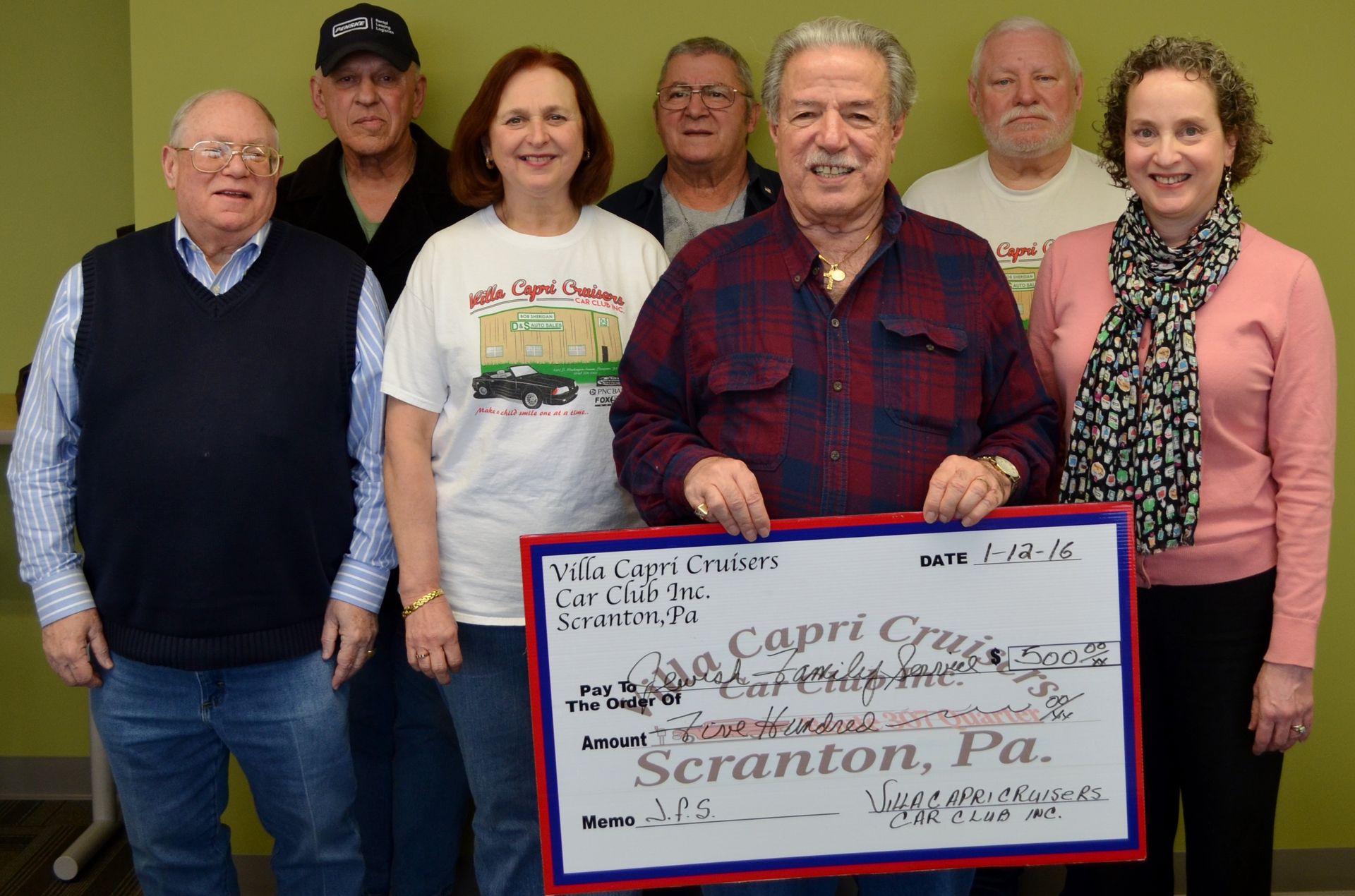 Group of people holding a large check in Scranton, PA.