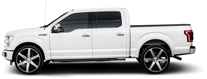 White pickup truck with black off-road trim, shown in side profile on a white background | Tinley Auto Repair & Towing Inc