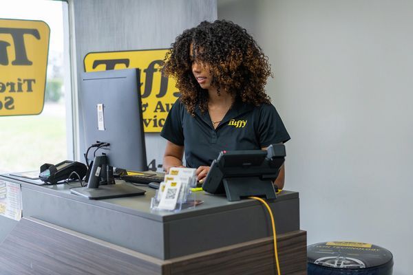 Tuffy employee at a desk