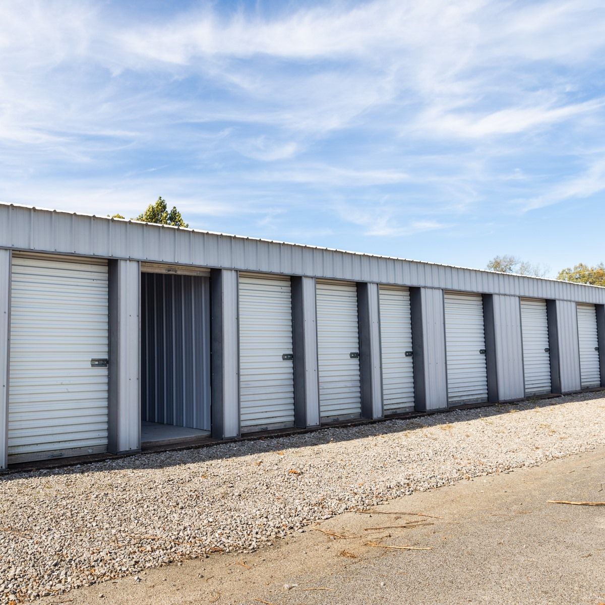 A row of storage units with a blue sky in the background