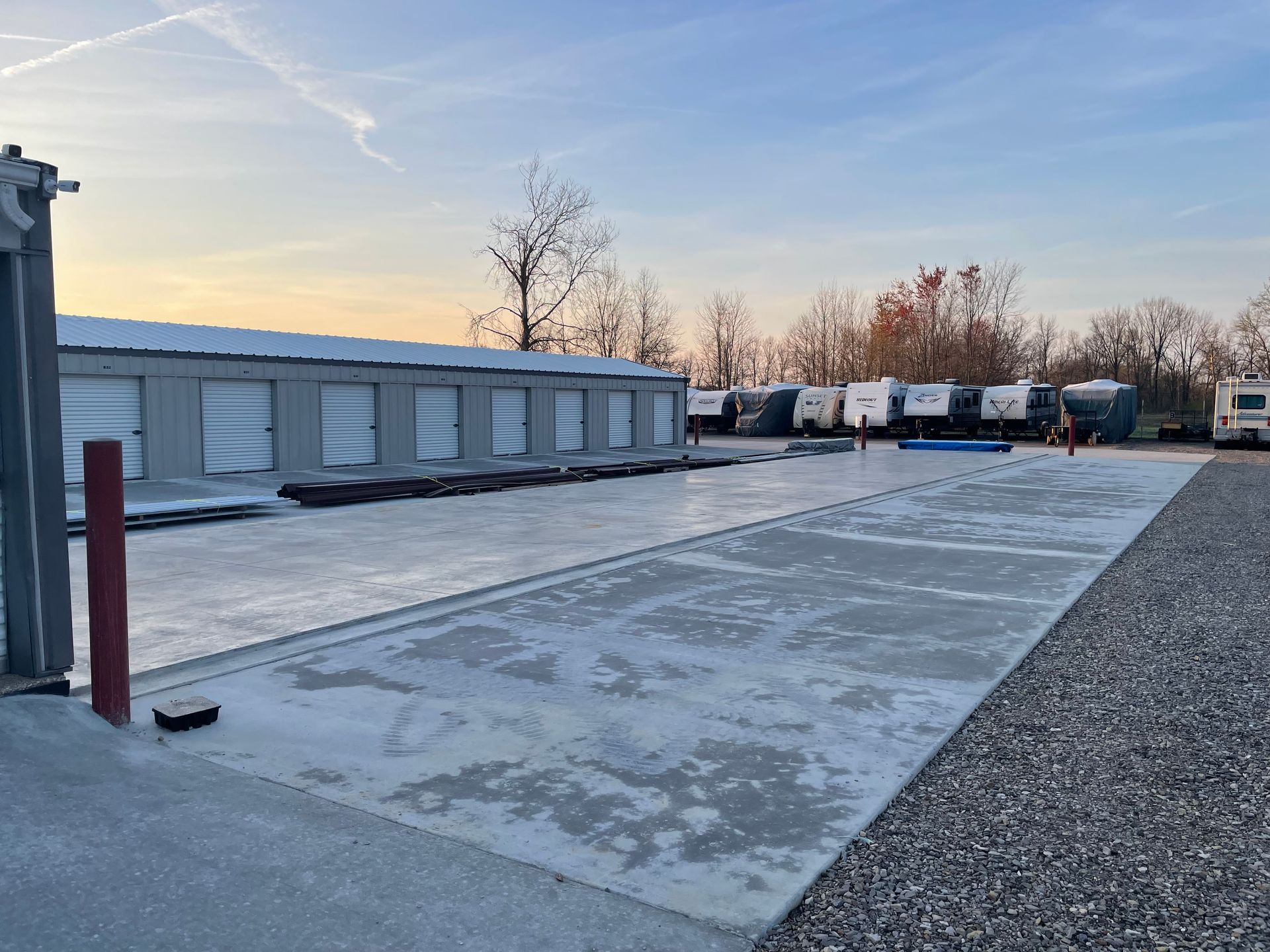 A parking lot with a lot of trailers parked in it.