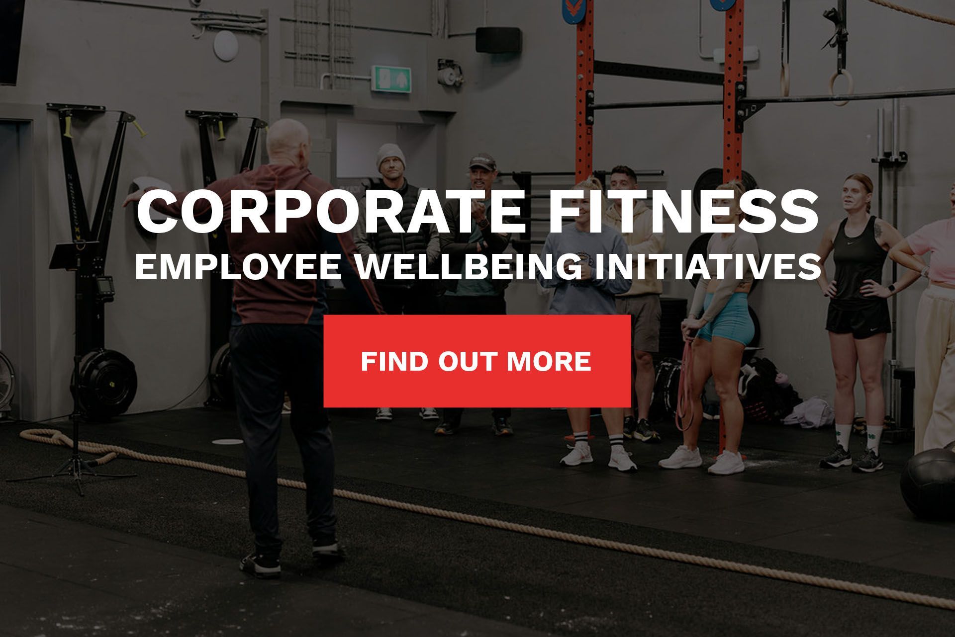 A group of men are doing exercises in a gym.