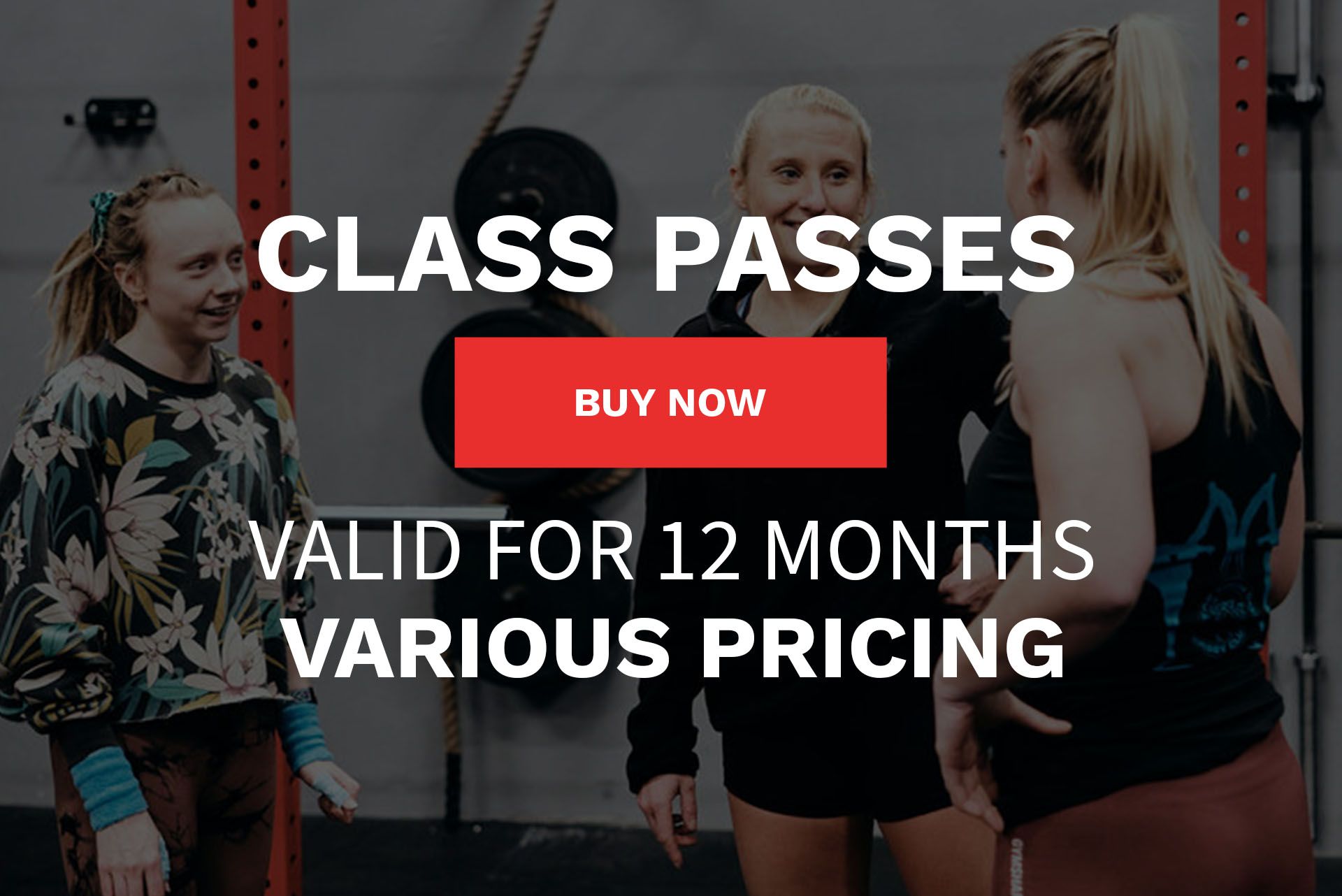 A group of women are standing next to each other in a gym.