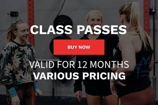 A group of women are standing next to each other in a gym.
