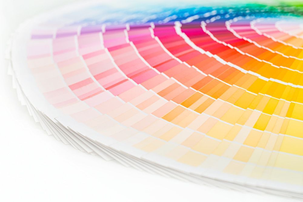 A Close Up Of A Rainbow Colored Color Wheel On A White Background — Armidale Colour Copy Centre In Armidale, NSW