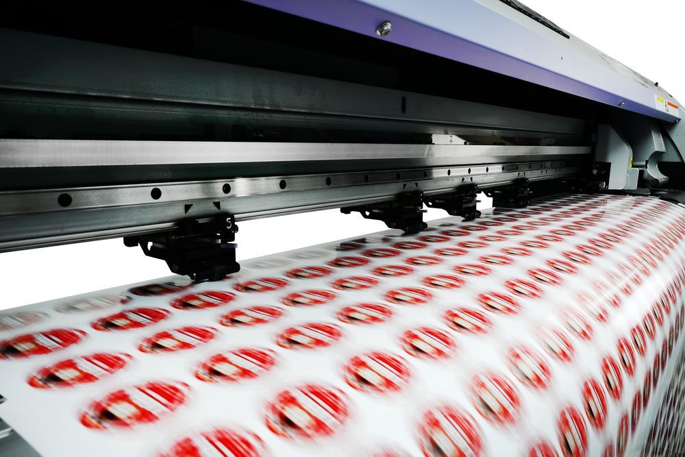 A Large Printer Is Printing Stickers On A Sheet Of Paper — Armidale Colour Copy Centre In Armidale, NSW