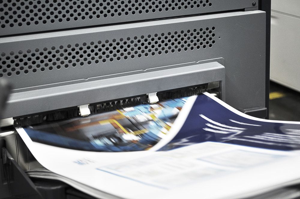 A Close Up Of A Printer Printing A Piece Of Paper — Armidale Colour Copy Centre In Armidale, NSW
