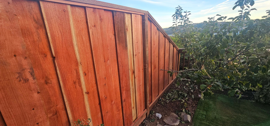 Redwood fence installation on technical downhill