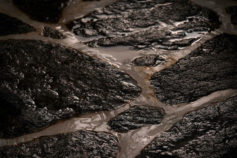 A close up of a rock with water running through it