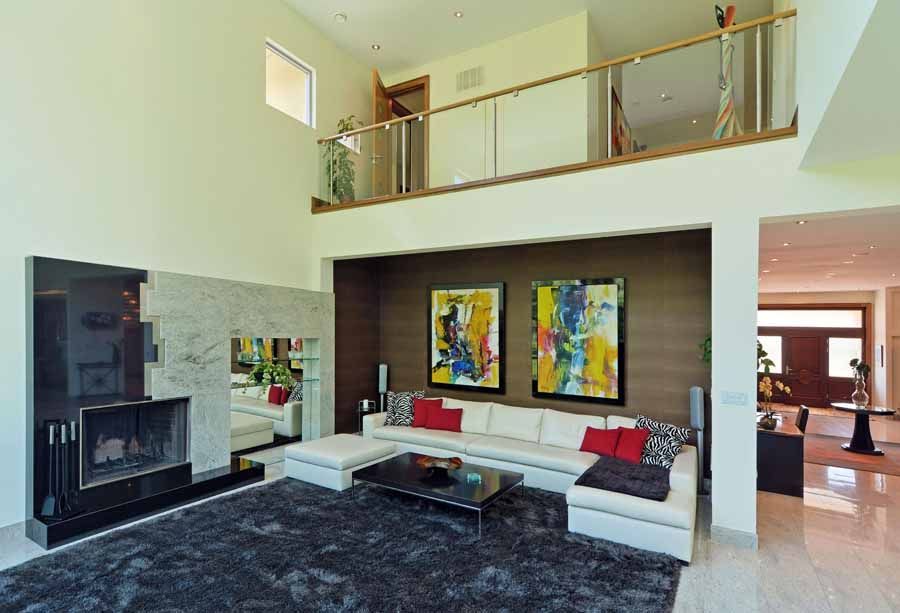 A living room with a couch and a fireplace