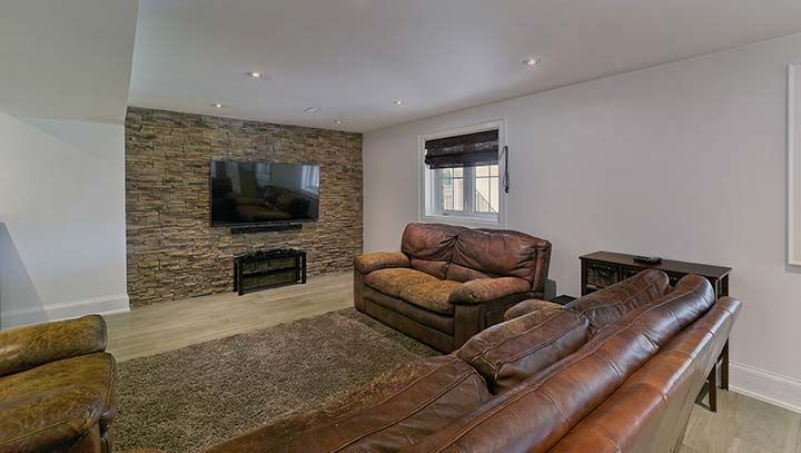 A living room filled with furniture and a flat screen tv.