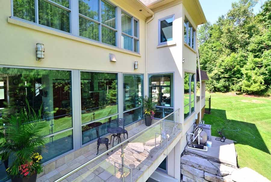 A large house with a lot of windows and a balcony