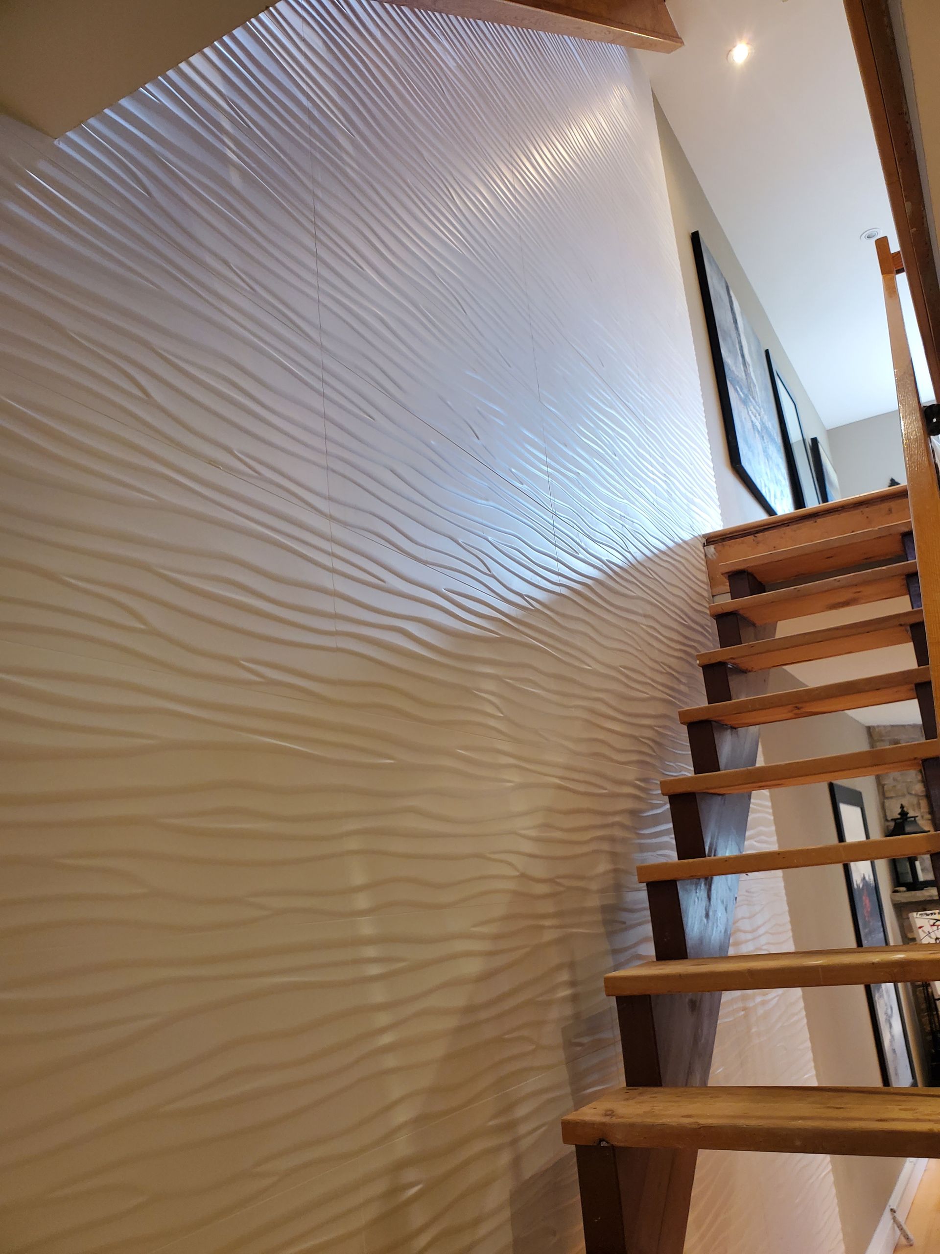 A wooden staircase leading up to the second floor of a house.