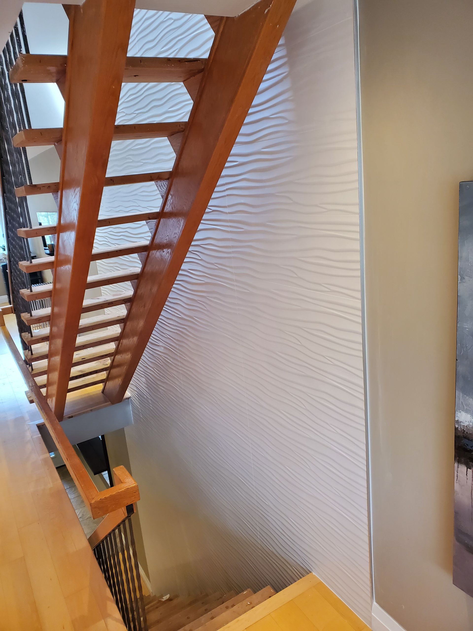 A wooden staircase leading up to the second floor of a house