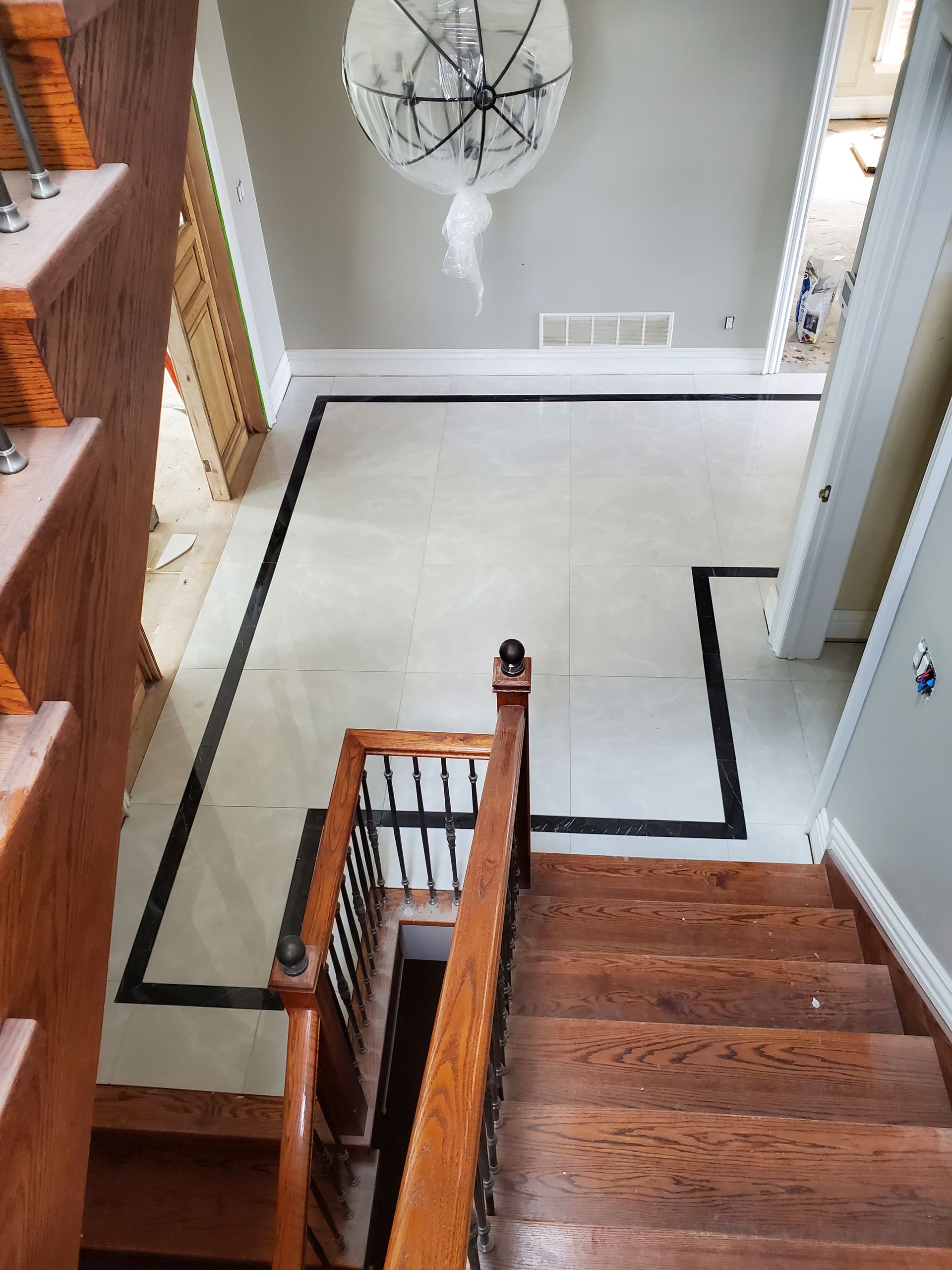 A wooden staircase leading up to the second floor of a house.