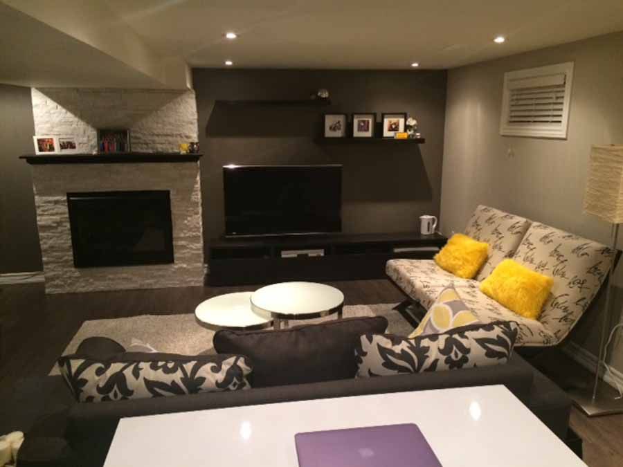 A living room with a couch and a fireplace