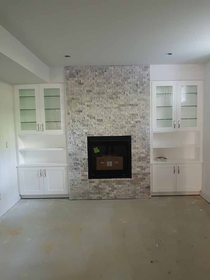 There is a fireplace in the middle of the room.