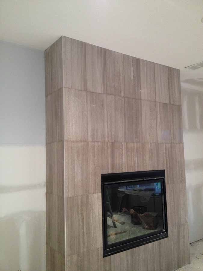 There is a fireplace in the middle of the room.