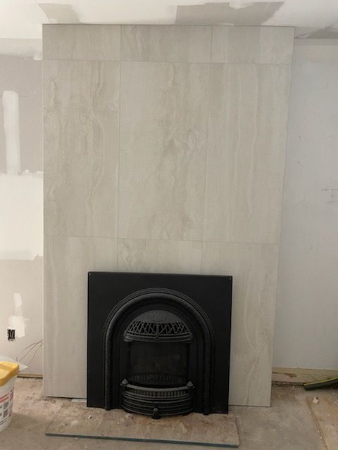 There is a fireplace in the middle of the room.