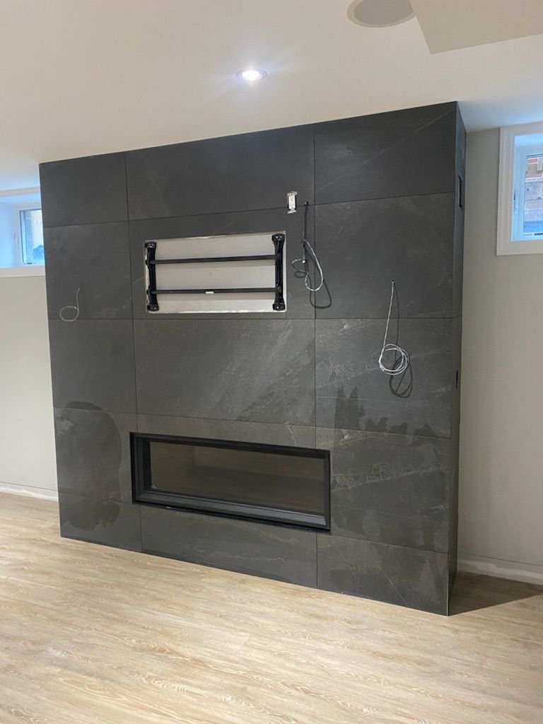 There is a fireplace in the middle of the room.