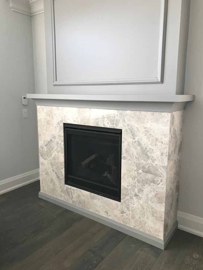 There is a fireplace in the middle of the room.