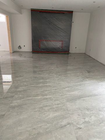 There is a fireplace in the middle of the room.