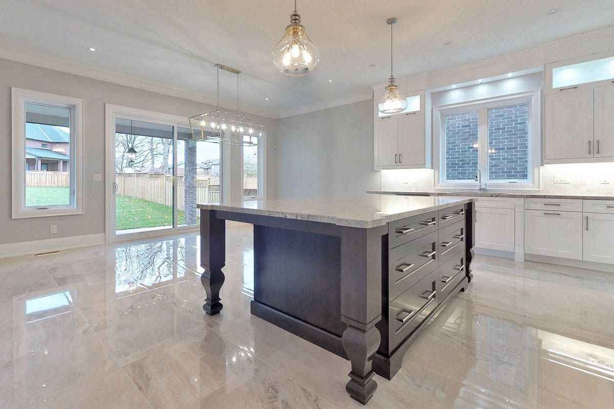 There is a large island in the middle of the kitchen.