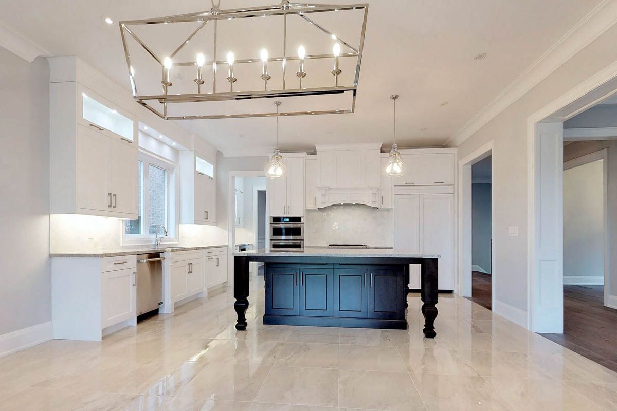 There is a large island in the middle of the kitchen.