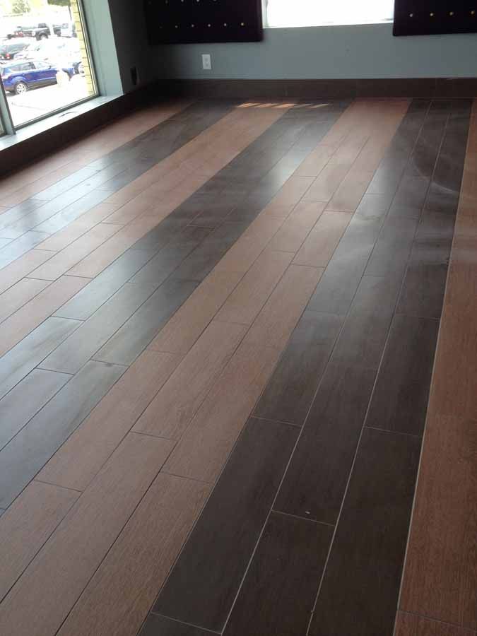 A room with a wooden floor and a window