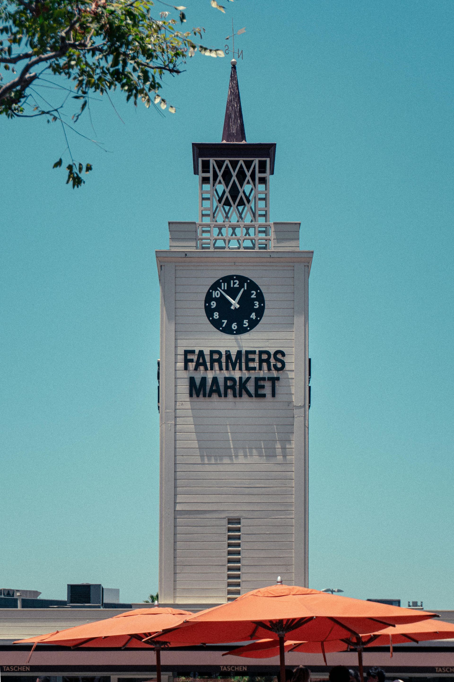 A tall, white clock tower with 