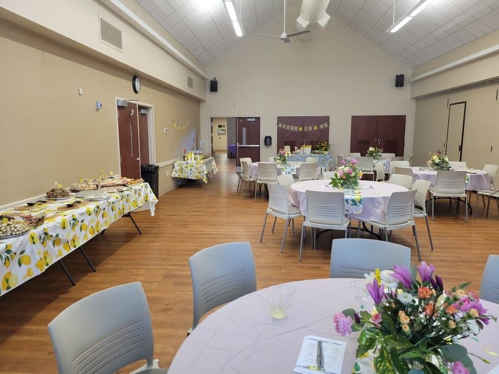 One section of evergreen room decorated for a baby shower.