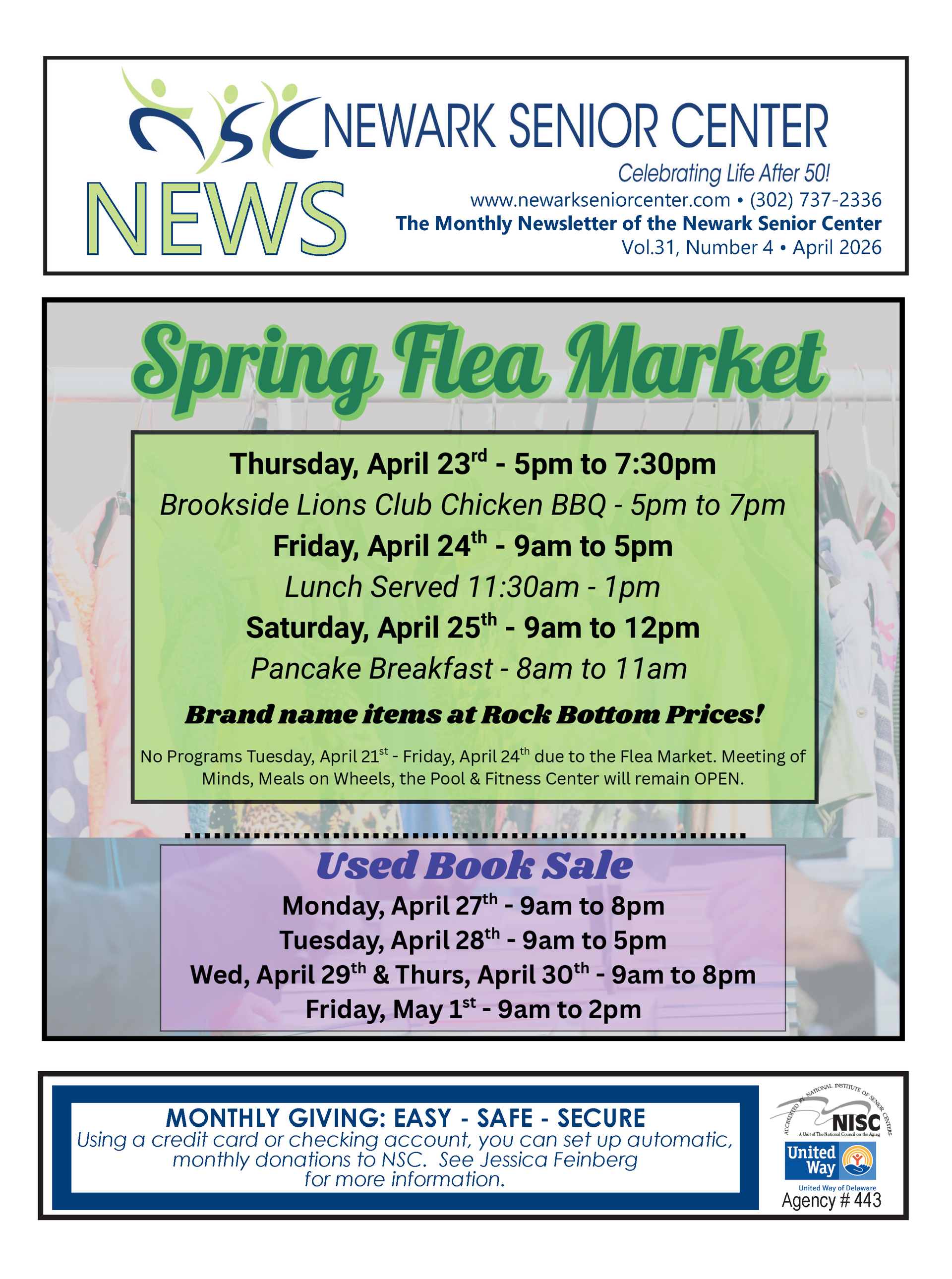 A person sitting in a recliner holding a sign decorated with balloons while two others smile at them indoors.