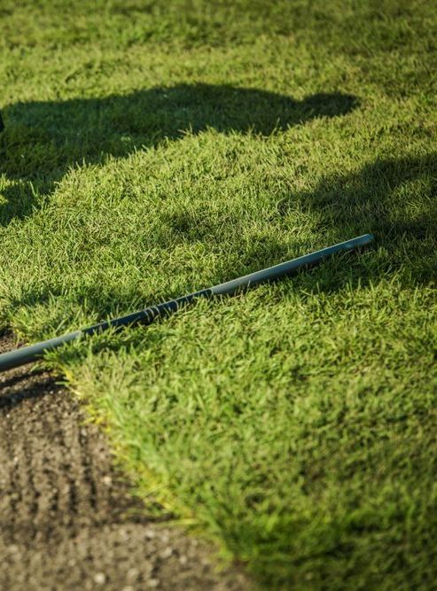 A Lawn Mower is Sitting on Top of a Lush Green Lawn — Ballina Turf Farm in Wardell, NSW