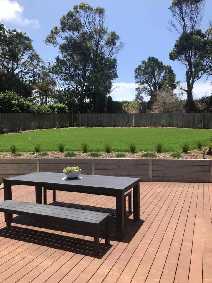 Tiered Backyard with Lawn and A Wooden Fence — Ballina Turf Farm in Iluka, NSW
