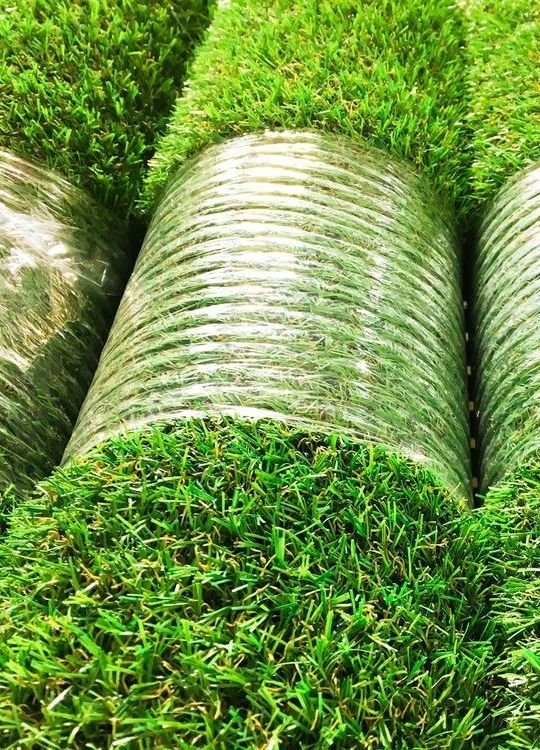 Close Up of Several Rolls of Fresh Green Turf Grass — Ballina Turf Farm in Woodburn, NSW