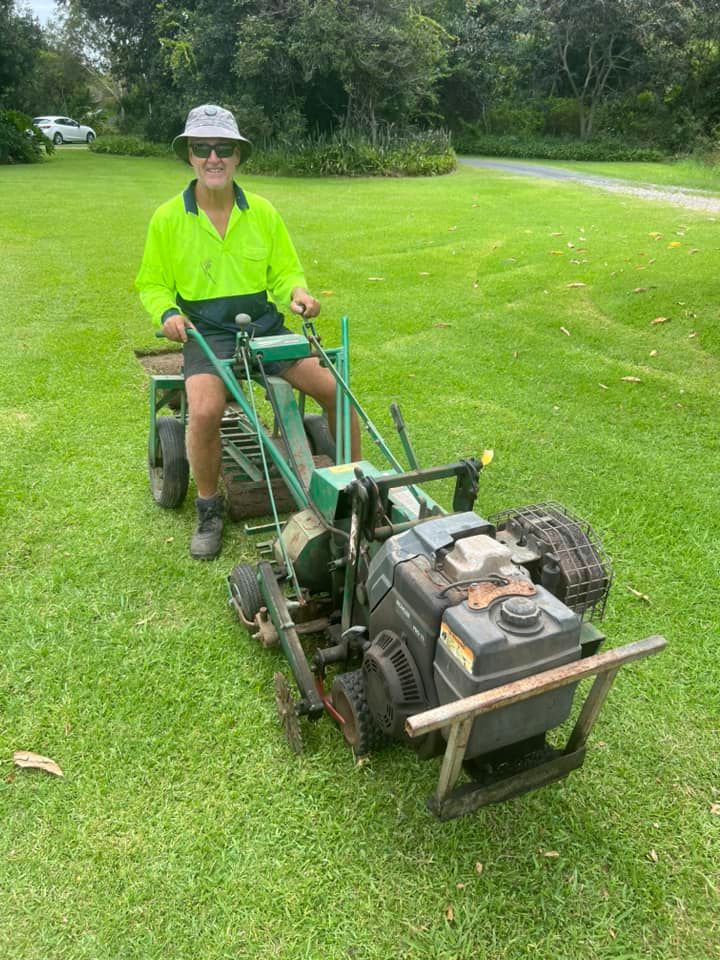 A Man is Riding a Lawn Mower on a Lush Green Field — Ballina Turf Farm in Casino, NSW