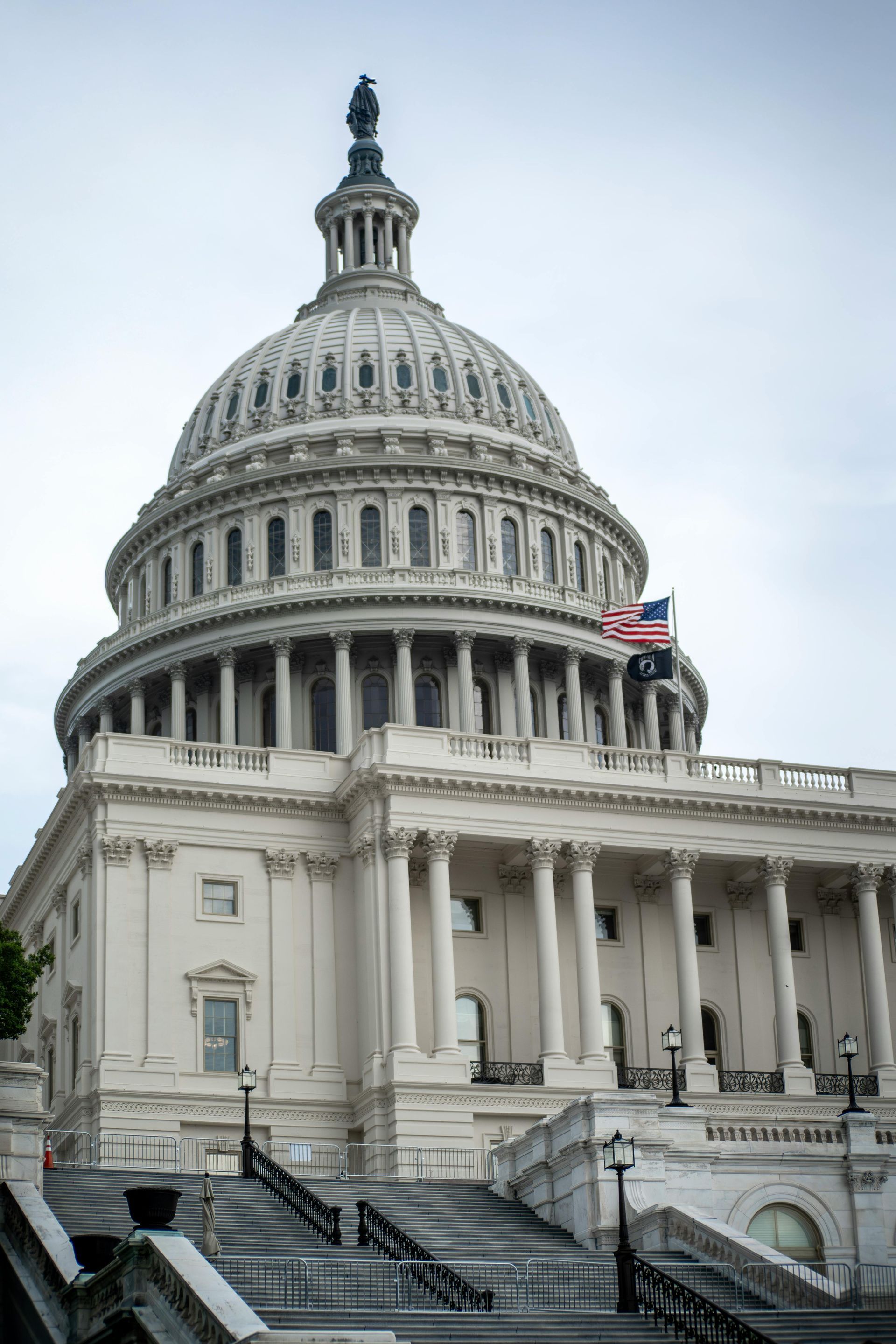 The capitol building in washington d.c. with a flag on top of it.