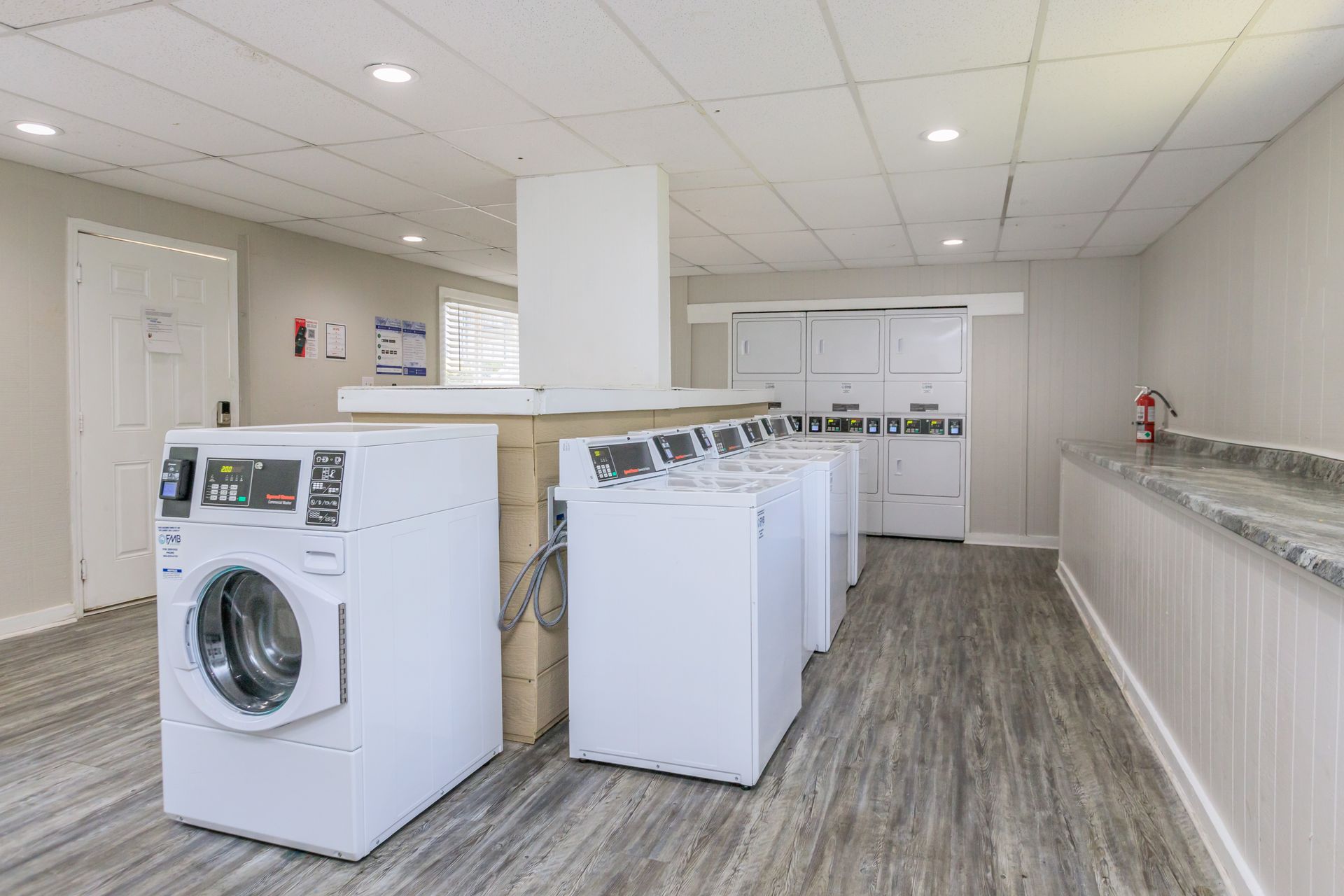 A laundry room with a washer and dryer in it.