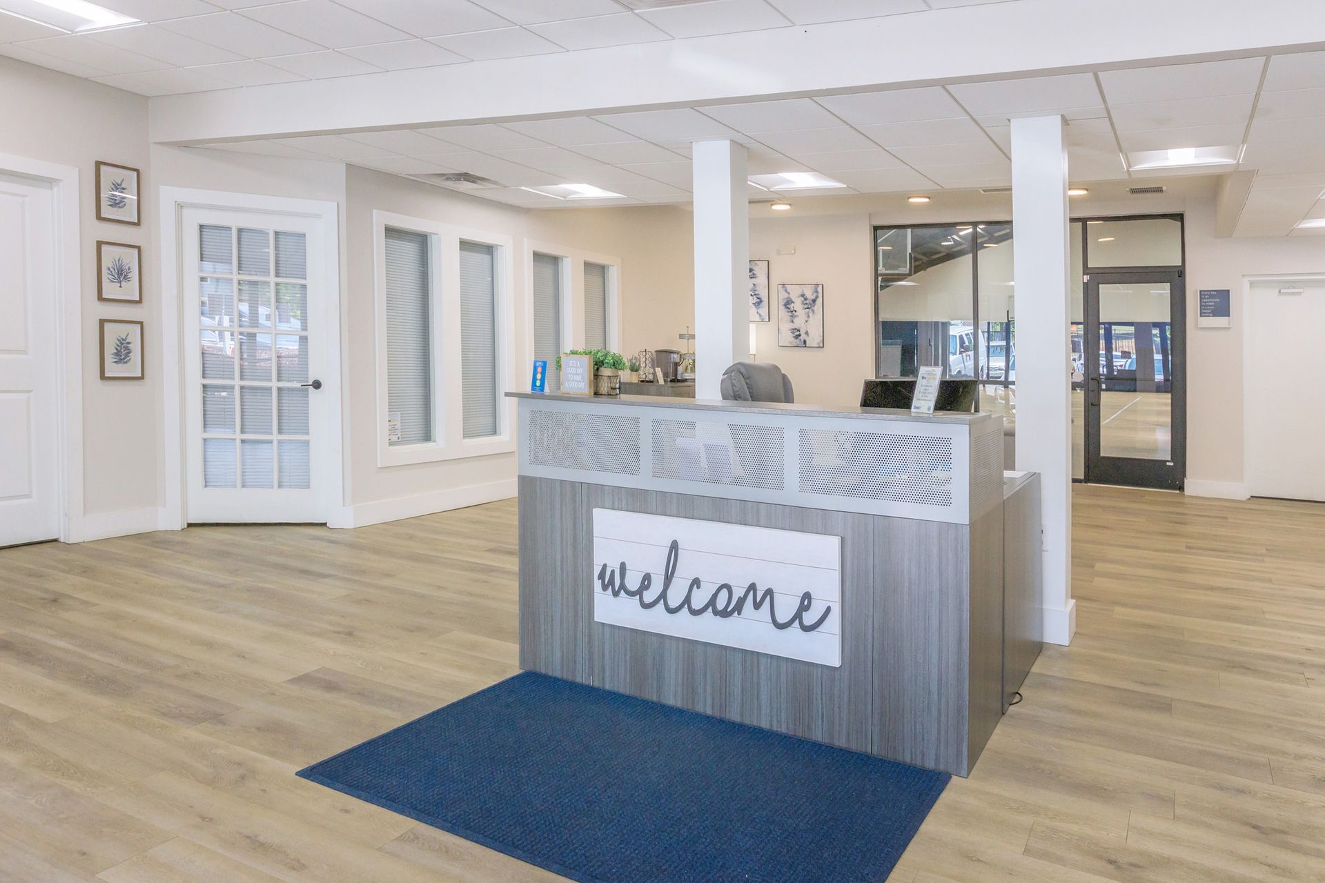 There is a welcome sign on the counter in the middle of the room.