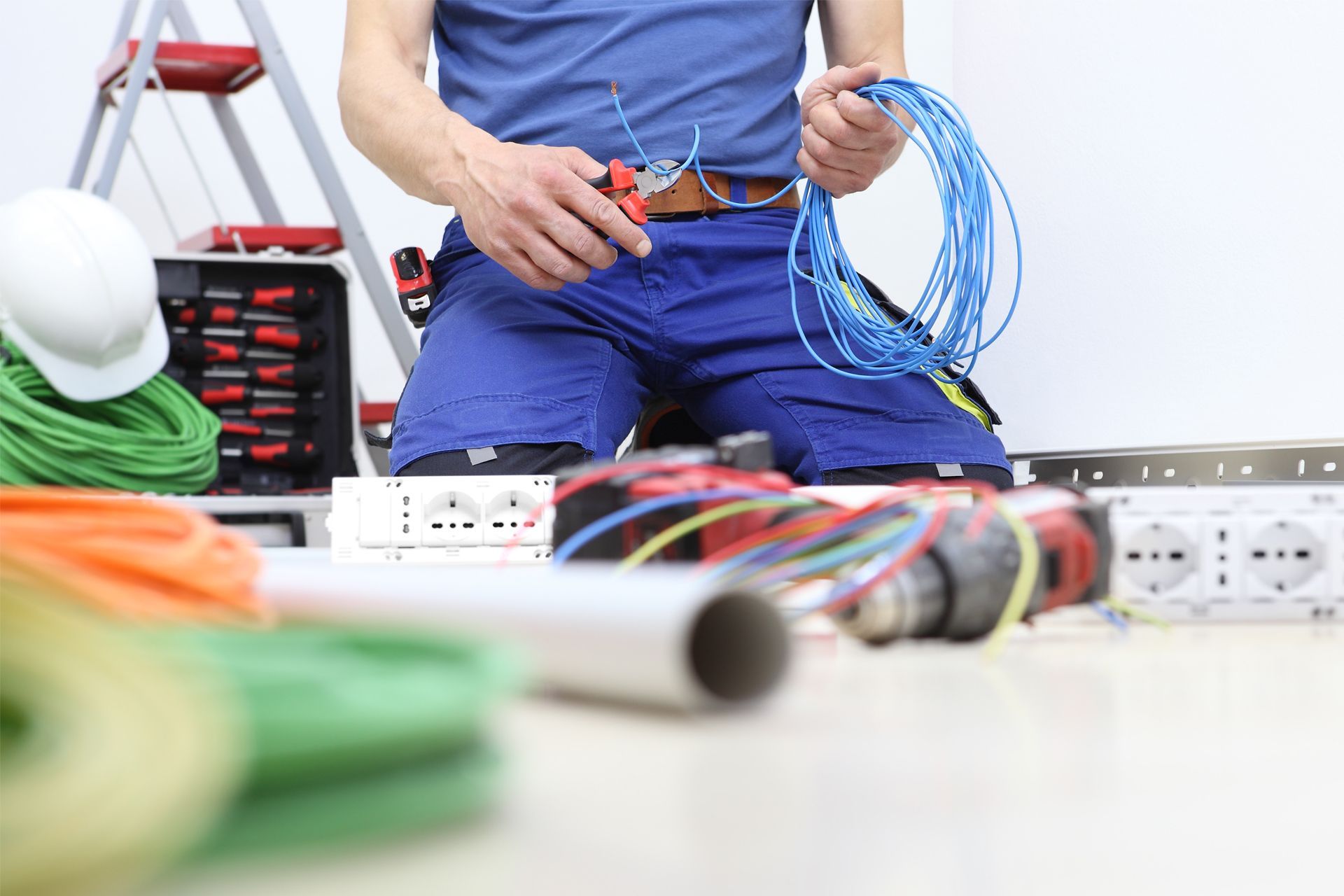 Electrician Cutting an Electrical Wire