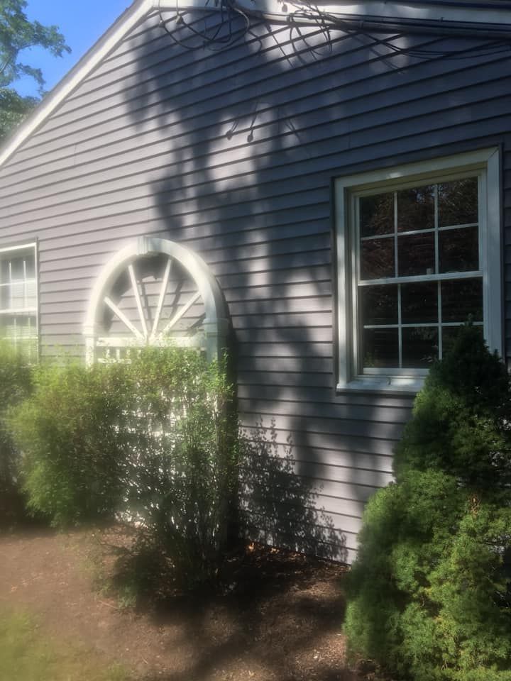 A house with a circular window on the side of it