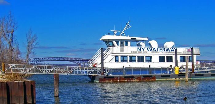 A boat called my waterway is docked at a dock.