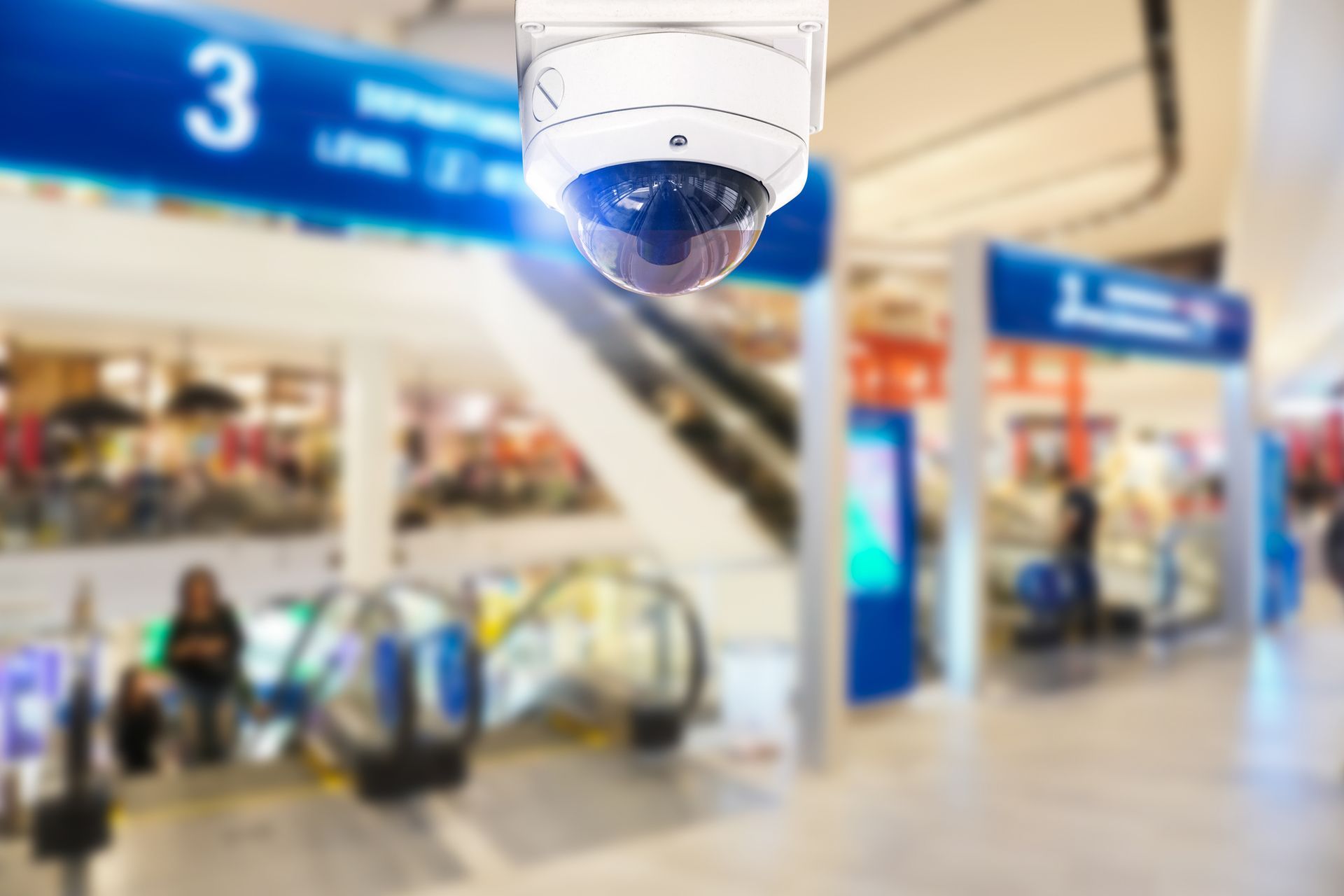 A security camera in a shopping mall shows Surveillance Systems for Retail Safety in Maryland.