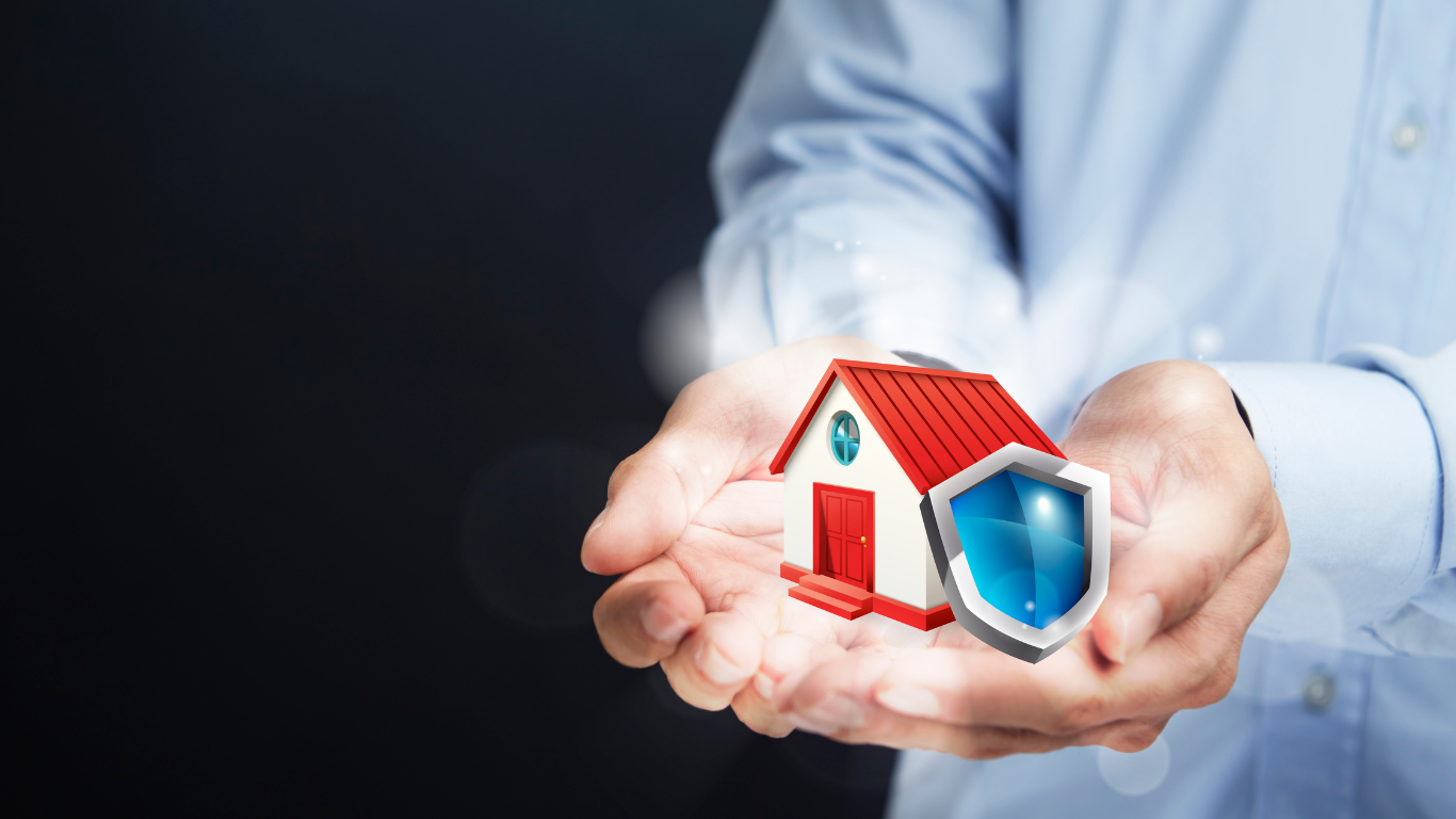 A man is holding a small house and a shield in his hands.