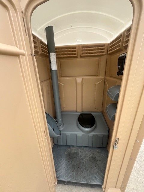 A blue and gray toilet with the lid open