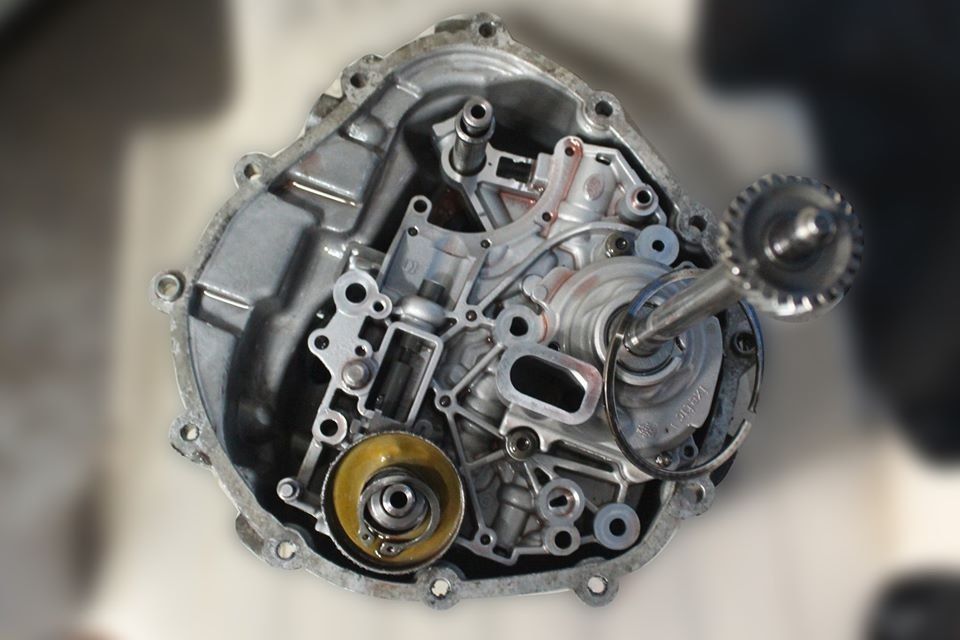 Internal view of a disassembled DSG mechatronic unit showing the hydraulic and mechanical components used in dual-clutch transmission systems.